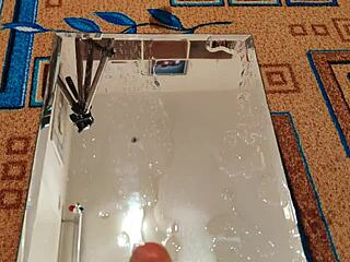 Passionate beauty squirts hard with dildo on mirror