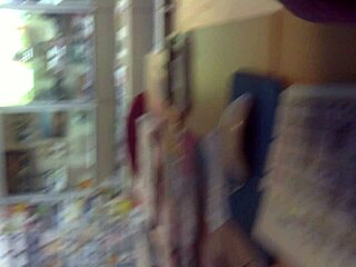 I'm stroking my cock in the internet cafe