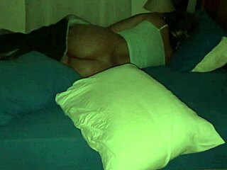 my wife lies on the bed with her ass exposed