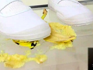 Japanese asian girl performs food crush fetish by crushing a banana