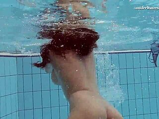 Hungarian beauty Sima showcases her alluring big tits underwater