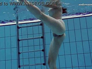 Hungarian beauty Sima showcases her alluring big tits underwater