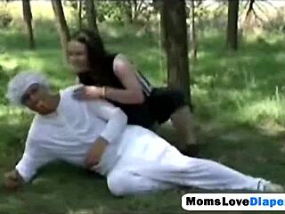 outdoor brunette milf enjoys anal strap-on play