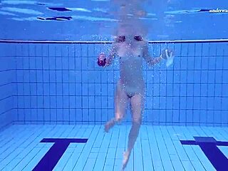 elena proklova strips in the pool, showing her tight pussy underwater