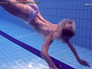 elena proklova strips in the pool, showing her tight pussy underwater