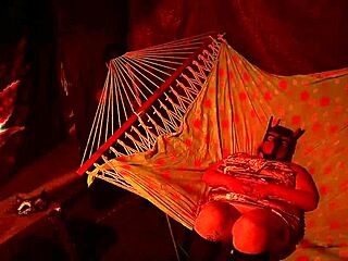 Getting frisky fingering wet hole in tent hammock!