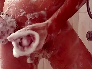 Boldly stroking my cock to a huge cumshot in the shower.