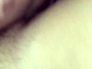 A young woman is taking something special from her partner in a casual way