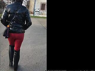 Fetish Wife Stuns in PVC Jacket, Leather Leggings, Gloves, and Boots in Public City