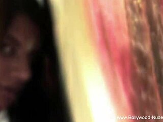 Her stunning nudity steals the show with sensual teasing in a softcore erotic scene by the music.