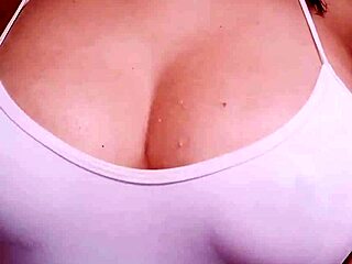 Hot cosplay girl shows off on webcam, teasing in anime costume.