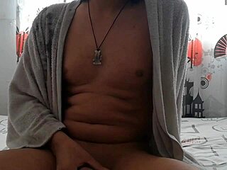 Latina masturbates big cock after shower in bathroom