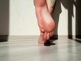 dominatrix nika shows off her beautiful feet in a sexy domination session, focusing on toes and fetish play.
