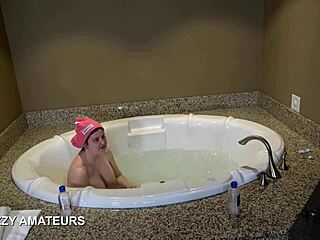 The super nerd with big tits soaks in a steamy bubble bath