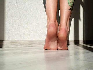 dominatrix nika shows off her beautiful feet in a sexy domination session, focusing on toes and fetish play.