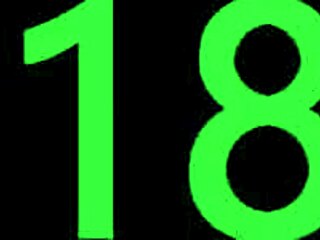 Dark-haired brunette with big nipples lounges on ottoman, showing off her perky tits