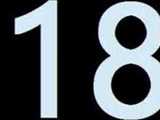 Dark-haired brunette with big nipples lounges on ottoman, showing off her perky tits