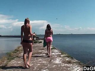 lesbian trio kissing and licking on the wharf