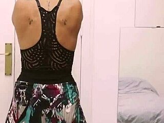 Short tattooed girl rips clothes in teasing striptease