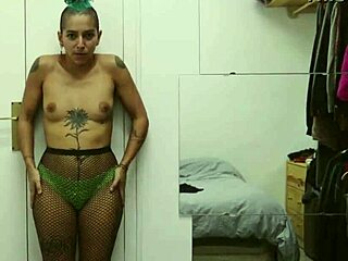 Short tattooed girl rips clothes in teasing striptease