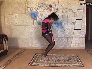 Teen gymnast stretches legs displaying huge tits