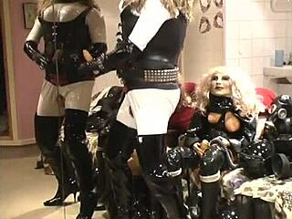 Roxina showcases her big clit in a shiny latex outfit during this video