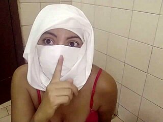 Real Muslim Arabian in hijabi masturbates creamy pussy. She shows off big tits in haram style.