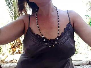 hey, check out this milf flashing her pierced pussy outdoors with big nipple rings