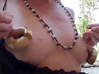 hey, check out this milf flashing her pierced pussy outdoors with big nipple rings