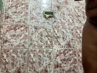 Morena with huge tits shows off in the shower, teasing her pussy