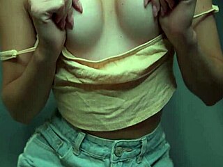 Sexy girl in denim shorts teases her wet pussy