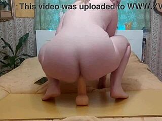 Riding giant dildo roughly in close up