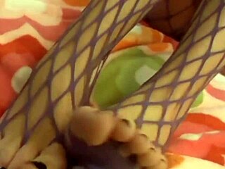 This chick in fishnets is toying her pussy hole so cutely