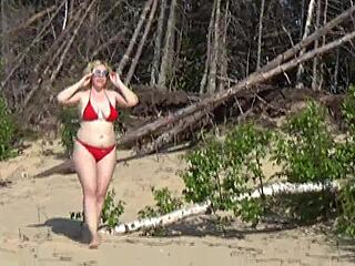 Bikini babe flaunts assets on beach