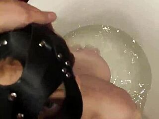 Masked Brunette Gags on Cock in Bathroom