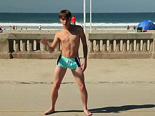 Twink Dancing On The Beach In Speedo