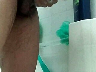 Young guy washes his big brown monster cock in homemade solo close-up