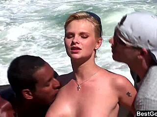 Busty Blonde Tarra White Sucking Big Black Cock In Ocean Threesome