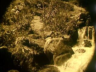 nude woman by waterfall