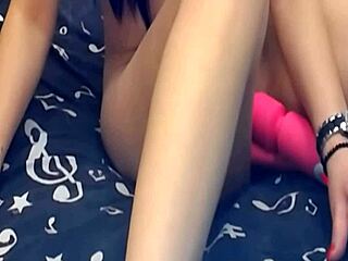 girl plays with two dildos on webcam
