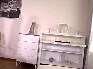 Gorgeous black-haired secretary Daphne Klyde in heels and stockings gives foot job to boss