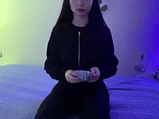 Is the tattooed woman with big ass fingering herself on bed because her vagina is so wet?