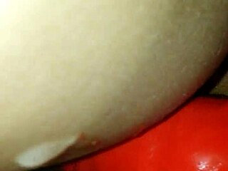 The wife enjoys a latex fuck from her lover in doggystyle position