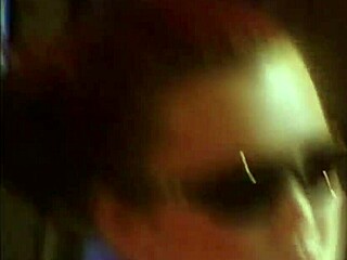 Aya Holmes in red car with boots, masturbating in fetish style.