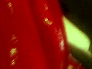 Aya Holmes in red car with boots, masturbating in fetish style.