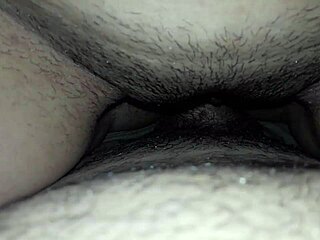 A sensual beauty relaxes on her stool before indulging in a refreshing glass of milk