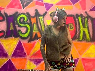 Sexy punk girl sits and bounces deep in public outdoor scene