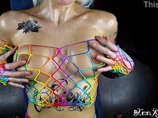 Rainbow tattoo girl gives oily titfuck