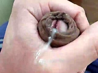 Young boy with a big cock gives a handjob and cums