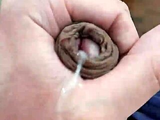 Young boy with a big cock gives a handjob and cums